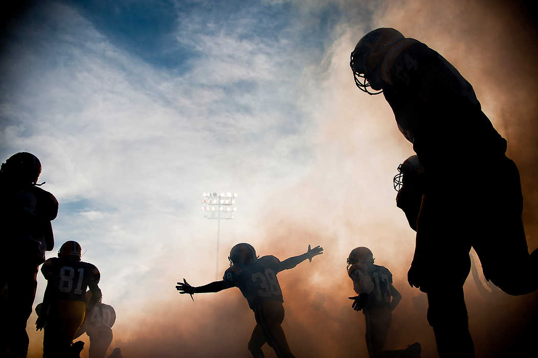 Second Place, Team Picture Story  - Ryan M.L. Young / ThisWeek Community NewsThe Reynoldsburg football team takes the field prior to the start of their game against New Albany at Reynoldsburg High School.