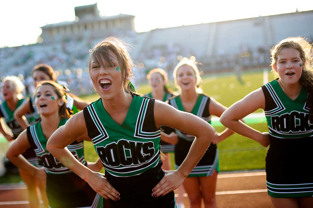 Second Place, Team Picture Story  - Joshua A. Bickel / ThisWeek Community NewsDublin Coffman junior cheerleader Ashley Williams practices with the rest of the squad before the Shamrocks' football game against Dublin Scioto.
