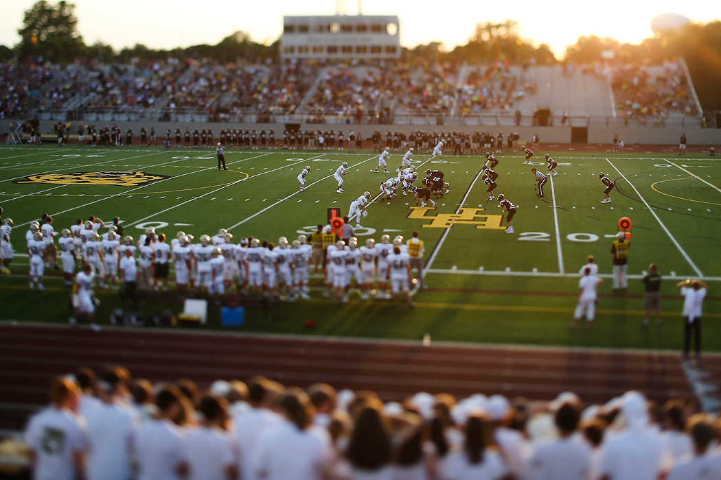 Second Place, Team Picture Story  - Joshua A. Bickel / ThisWeek Community NewsDublin Jerome runs a play during the Celtics' football game against Upper Arlington. Upper Arlington defeated Dublin Jerome, 36-0. The effect in the photo was created using a tilt-shift lens.