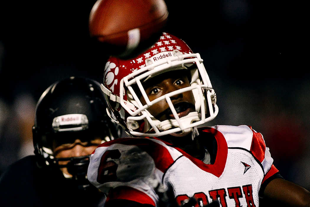 Second Place, Team Picture Story  - Joshua A. Bickel / ThisWeek Community NewsWesterville South wide receiver Marcus Williamson (6) watches as a pass sails over his head during the Wildcats' football game against Westerville Central.