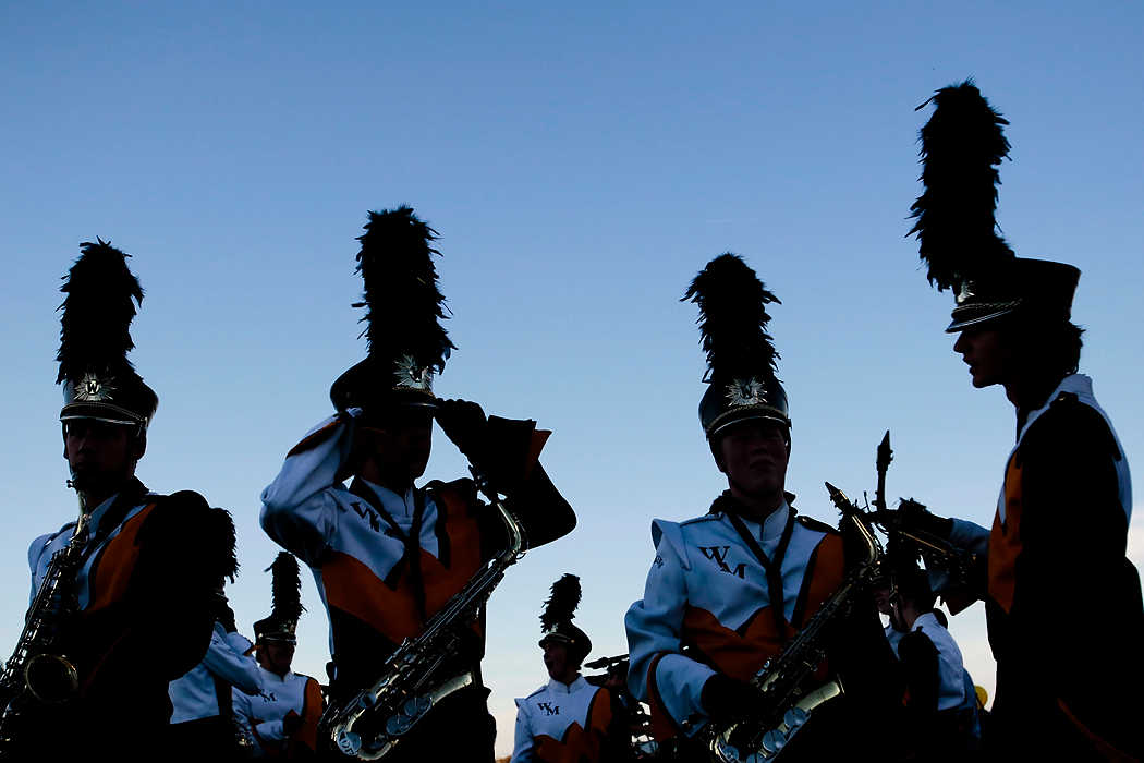Second Place, Team Picture Story  - Joshua A. Bickel / ThisWeek Community NewsMembers of the Watkins Memorial Marching Band prepare for their pregame performance before the Warriors' football  game against Newark Catholic.