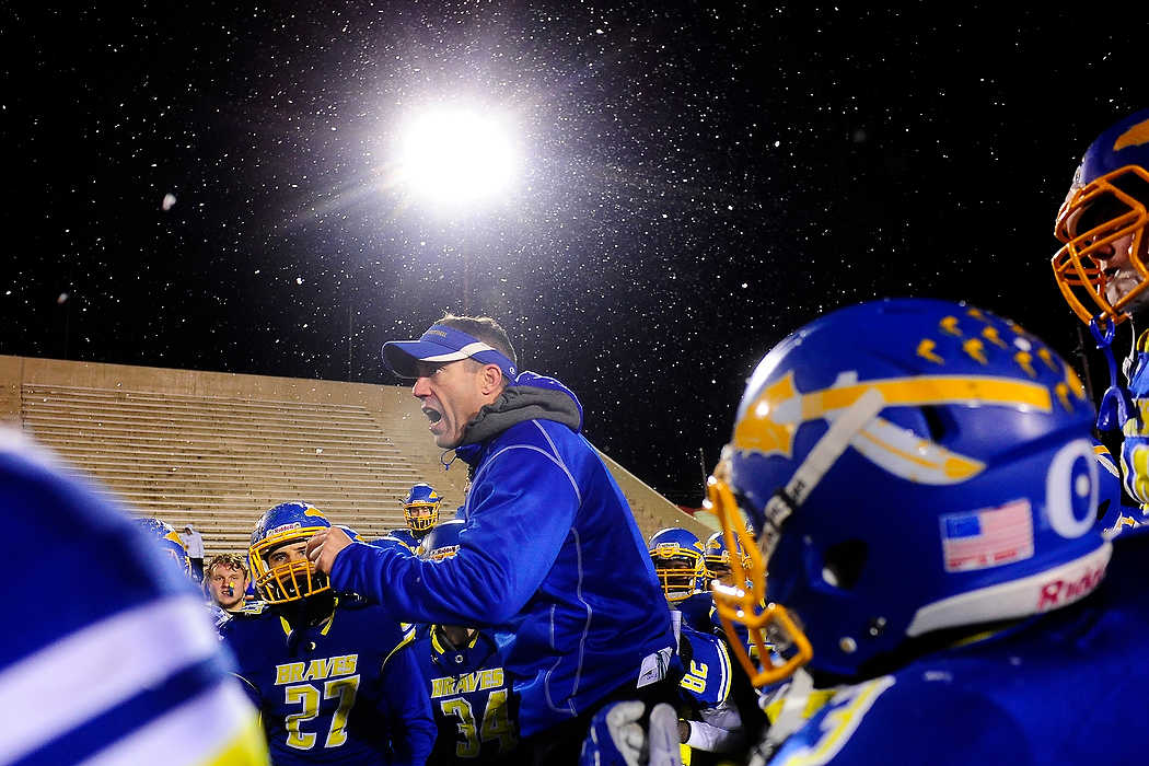 Second Place, Team Picture Story  - Ryan M.L. Young / ThisWeek Community NewsOlentangy Head Coach Mark Solis talks to his team following their 31-6 victory against Wooster in the Division II regional semifinal game.