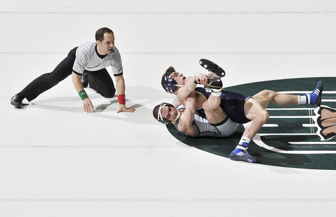 First place, Larry Fullerton Photojournalism Scholarship - Sarah Stier / Ohio UniversityOhio Bobcats' Cody Walters battles Clarion University's Michael Pavasko to a 9-4 decision win. 