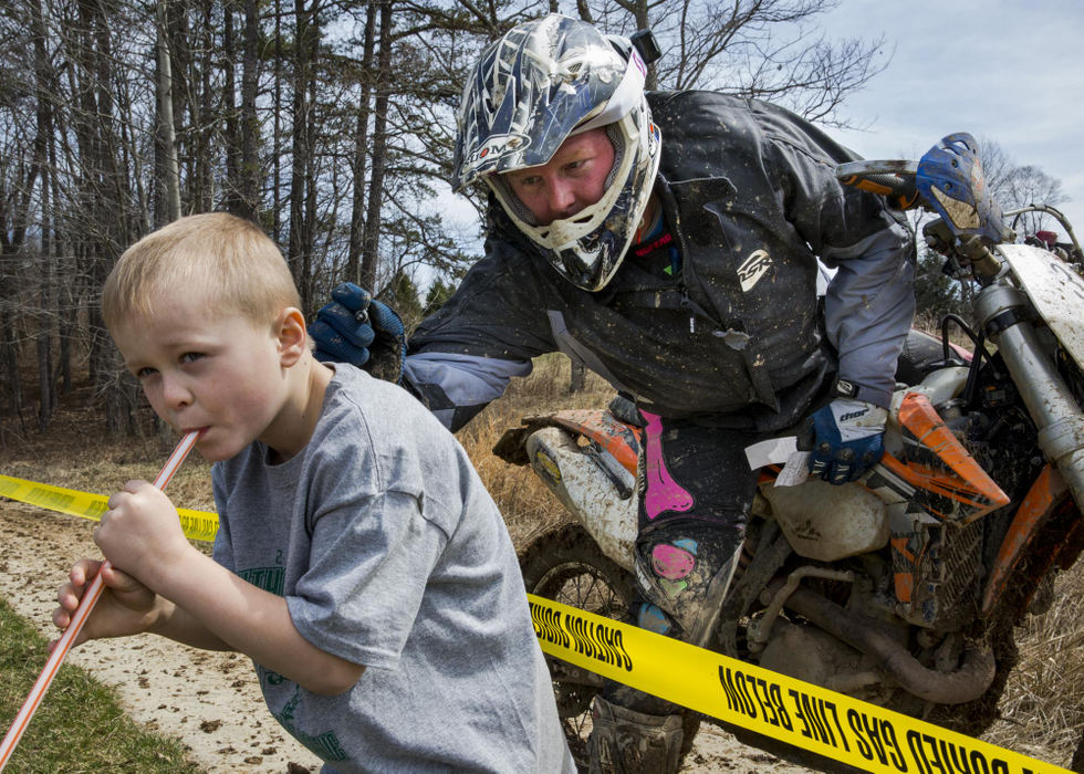 Second place, Larry Fullerton Photojournalism Scholarship - Alex Driehaus / Ohio UniversityRyder Althouse, 6, son of Eugene and Danielle Althouse of Albany, Ohio, has his shirt signed by Colin Klier of Canal Winchester, one of the many participants of the Lost in Lodi Enduro in Shade, Ohio. 