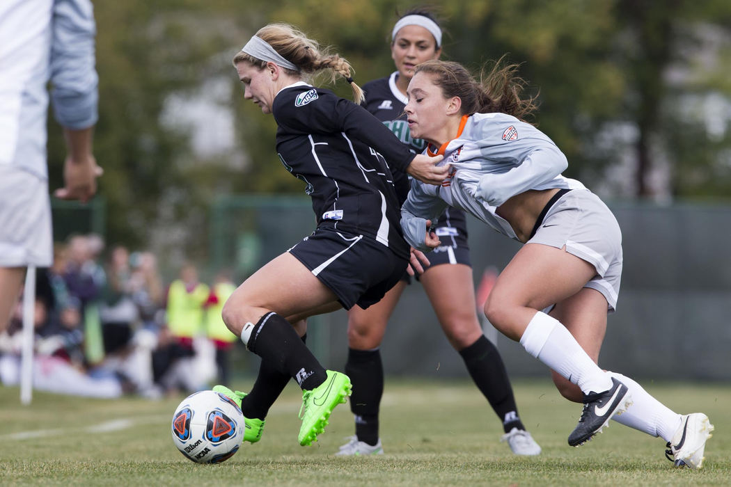 Second place, Larry Fullerton Photojournalism Scholarship - Alex Driehaus / Ohio UniversityOhio midfielder Mollie Whitacre attempts to hold back a Bowling Green defender during a game at Chessa field in Athens. 