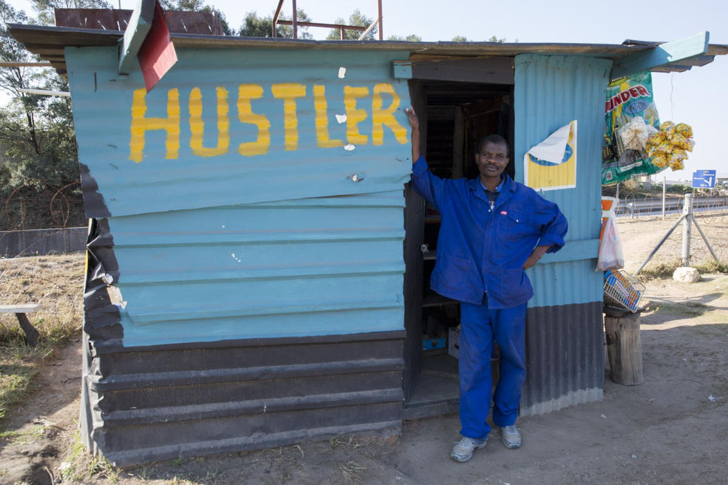 Second place, Larry Fullerton Photojournalism Scholarship - Alex Driehaus / Ohio UniversityA man poses for a portrait outside of his tuck shop in Mbabane, Swaziland. Tuck shops are extremely common in Swaziland and line the streets selling snacks and airtime.