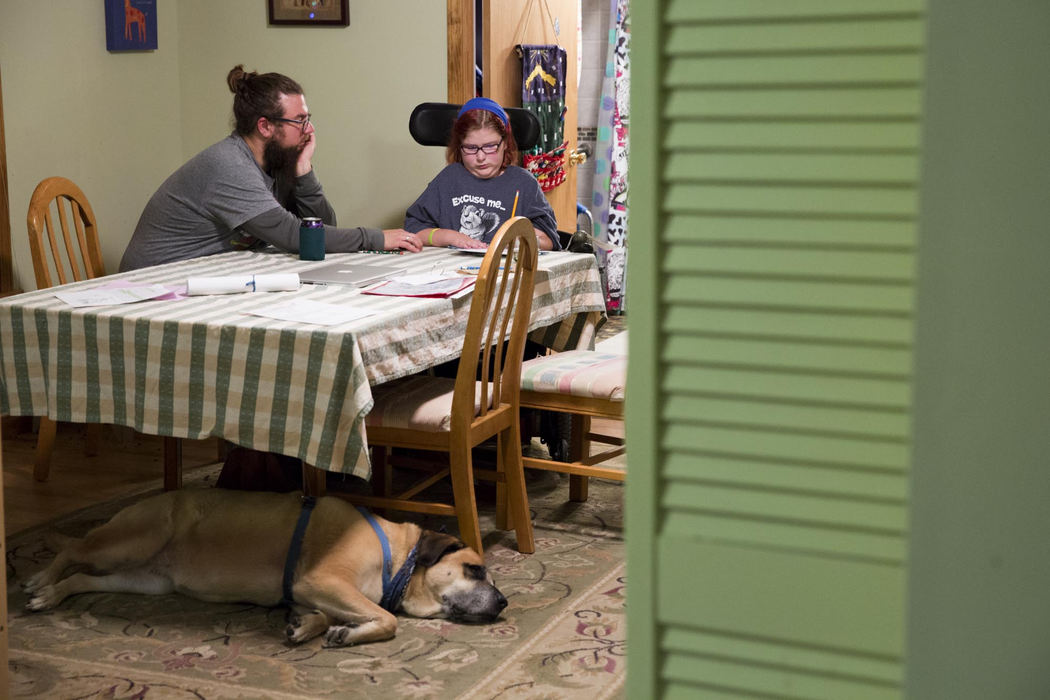 Second place, Larry Fullerton Photojournalism Scholarship - Alex Driehaus / Ohio UniversityBrian helps Adyn with her homework. Adyn completes her social studies homework quickly and easily, but hates working on math and spends much more time on it.