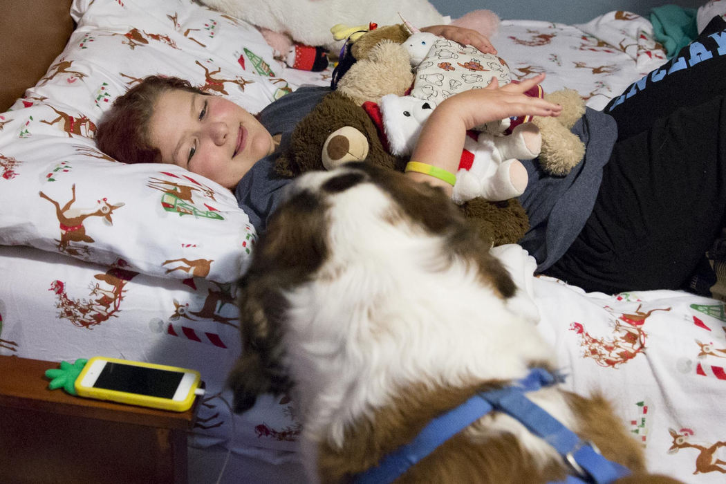 Second place, Larry Fullerton Photojournalism Scholarship - Alex Driehaus / Ohio UniversityThe Bucher's Saint Bernard Macy comes to Adyn's bedside as she prepares to go to sleep. Macy walks into Adyn's room every night as she is put to bed.