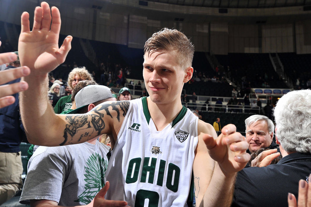 First place, Larry Fullerton Photojournalism Scholarship - Sarah Stier / Ohio UniversityOhio Bobcats forward Treg Setty high-fives fans after playing his final game at the Convocation Center in Athens. Setty, a crowd favorite, earned a career-high 24 points during the game against Buffalo. 