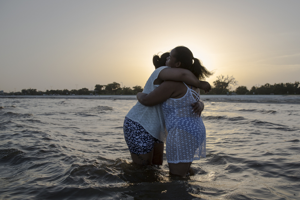 Best of Show - Liz Moughon / Ohio UniversityMicheshia hugs her cousin, Neca Jones.