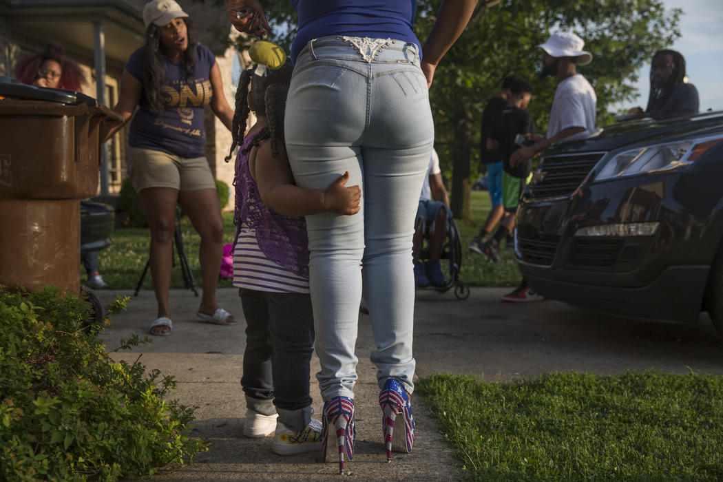 Best of Show - Liz Moughon / Ohio UniversityZanique Norment, 3, Micheshia's only other child, wraps her arm around her mother's leg at a family barbecue. "What do you tell to a three-year-old that's been with her brother for three years?" Micheshia says. "He's gone to another life. We may not see him, but he sees us. That's the only way I can explain it to my daughter." After Dequante was killed, Micheshia considered suicide but decided to fight for her daughter instead, knowing that's what Dequante would want.