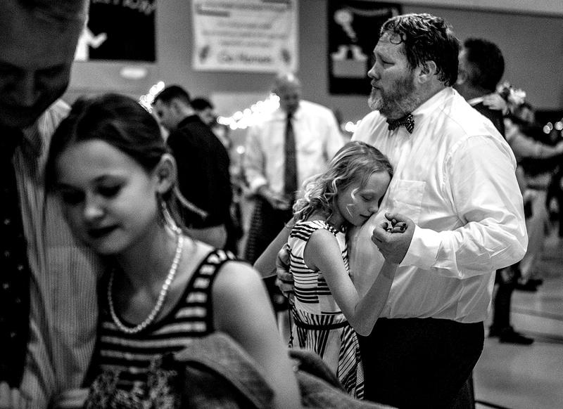 Award of Excellence, Feature - Jessica Phelps / Newark AdvocateJoesph Woods dances with his daughter, Landynne, 10, during the song 'Butterfly Kisses' at the Daddy Daughter dance Saturday night at Licking Heights Elementary South. The dance was organized by YMCA Western Branch, and is their biggest fundraiser for the year.