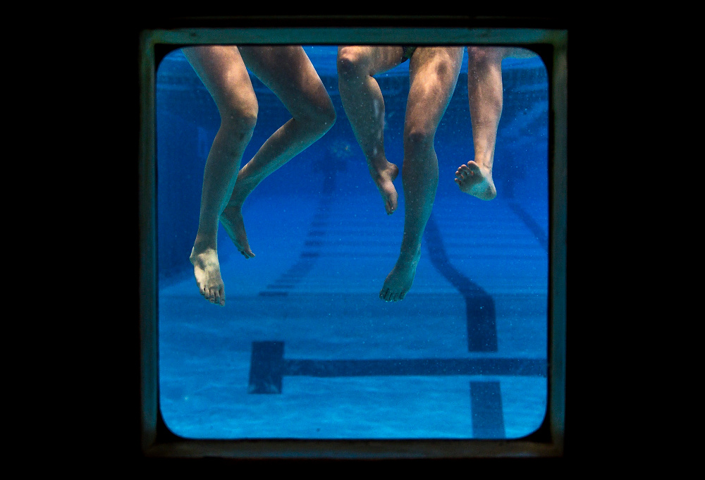 Award of Excellence, Pictorial - Emma Howells / Ohio UniversityOhio University swimmers who participated in the Olympic trials in Omaha, Nebraska, fool around in an underwater window at the aquatic center.