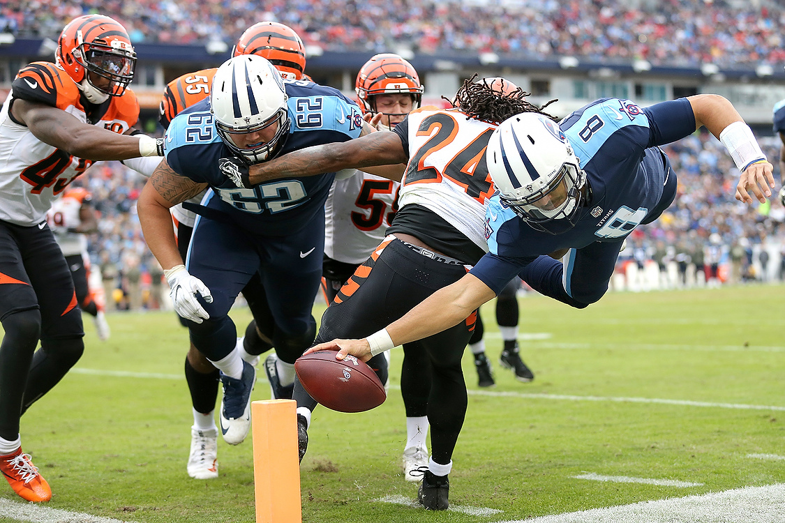 Award of Excellence, Sports Action - Kareem Elgazzar / The Cincinnati EnquirerTennessee Titans quarterback Marcus Mariota (8) dives for the end zone in the second quarter at Nissan Stadium in Nashville.