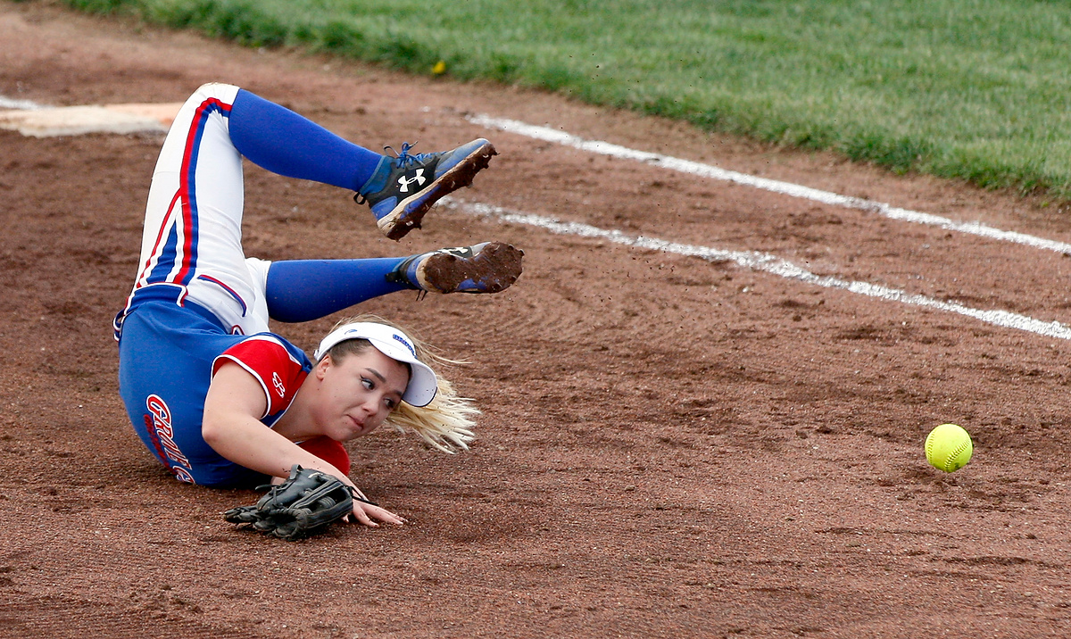 Award of Excellence, Sports Action - Shane Flanigan / ThisWeek Community NewsGrove City's Sierra Reid twists on the ground after attempting to make a diving catch during a game against Hilliard Davidson at Grove City High School. Hilliard Davidson defeated Grove City, 2-0.