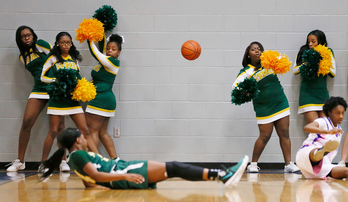 Third Place, Sports Feature - Fred Squillante / The Columbus DispatchNorthland cheerleaders dodge a loose ball during the girls City League championship game at South High School.