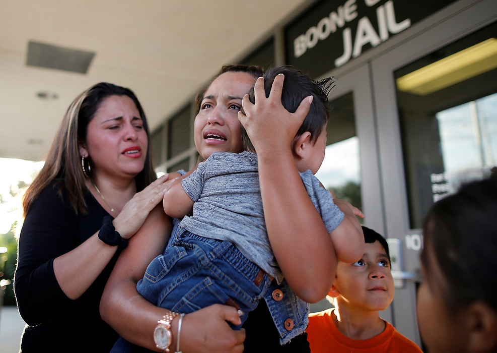 Second Place, Spot news - Sam Greene / The Cincinnati EnquirerRiccy Enriquez Perdomo hugs her 11-month-old son, Rony, and her sister Rita Enriquez as she is released from custody at the Boone County Jail in Burlington, Ky. Riccy Enriquez Perdomo was released from county jail, after being arrested Aug. 17. Enriquez, had been granted legal status two times through DACA (Deferred Action for Childhood Arrivals) but was arrested at an immigration office in Louisville. 
