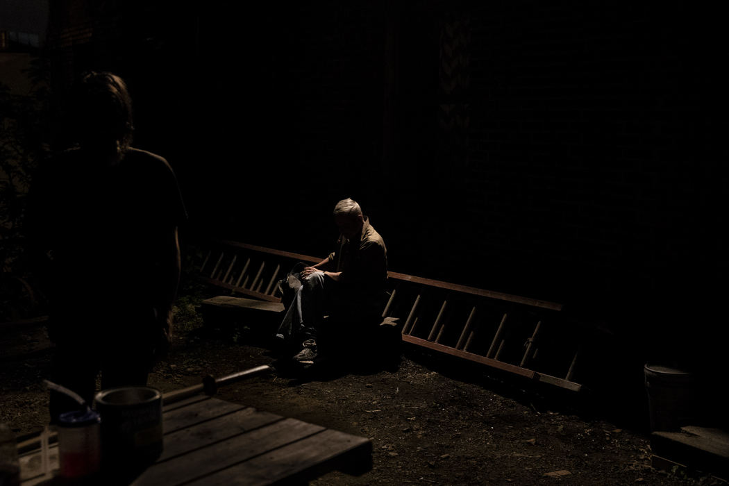 First Place, Student Photographer of the Year - Nathaniel Bailey / Kent State UniversityFollowing a rain storm, sitting under a flood light, a homeless man spends the evening outside, alone, not wanting to go to his soaked tent
