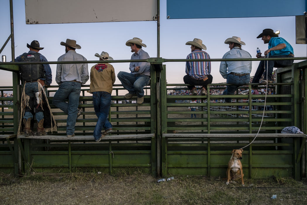 First Place, Student Photographer of the Year - Nathaniel Bailey / Kent State UniversityCowboys who had already completed their ride watch the final bull rider at the Ennis Rodeo in Ennis, MT, on July 4, 2018.