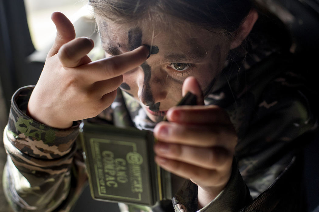 Third Place, Student Photographer of the Year - Marlena Sloss / Ohio UniversityMaris Drew of Jasper, 11, applies camo face paint in the hunting blind at the Youth Turkey Hunt at Patoka Lake, Ind. on April 21, 2018. Drew's hunting guide Shannon Gillette of Markleville brought the camo face paint, and said that the face paint is "sacred" to her.