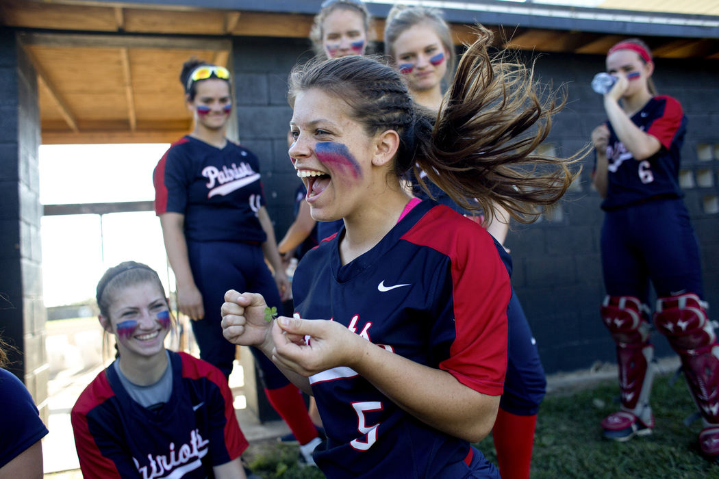 Third Place, Student Photographer of the Year - Marlena Sloss / Ohio UniversityHeritage Hills senior Maddie Fuller finds a four-leaf clover while searching the grass with her teammates and puts it in her sock for good luck before defeating Evansville Memorial 7-6 to win the sectional championship in Boonville, Ind. on May 24, 2018. Fuller made the seventh-inning game-winning hit, and after the game, exclaimed, "it was the clover!" Fuller said that “at the beginning of the season, we would always find four leaf clovers. And every time we found a four leaf clover we’d win. So it was a sign.”