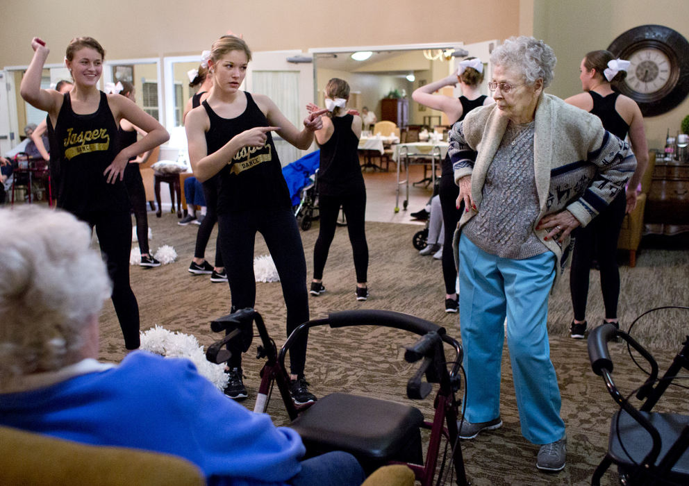 Third Place, Student Photographer of the Year - Marlena Sloss / Ohio UniversityBernice Burton of Jasper, right, dances with Jasper High School dance team senior Lydia Shepherd at the Brookside Village senior living community in Jasper, Ind. on January 23, 2018. "I'm 88, and I can still dance," said Burton. "This hip's been replaced three times, and this one once. And I can still do the twist." Burton loves to dance, and says when she was younger, she preferred dancing over eating.