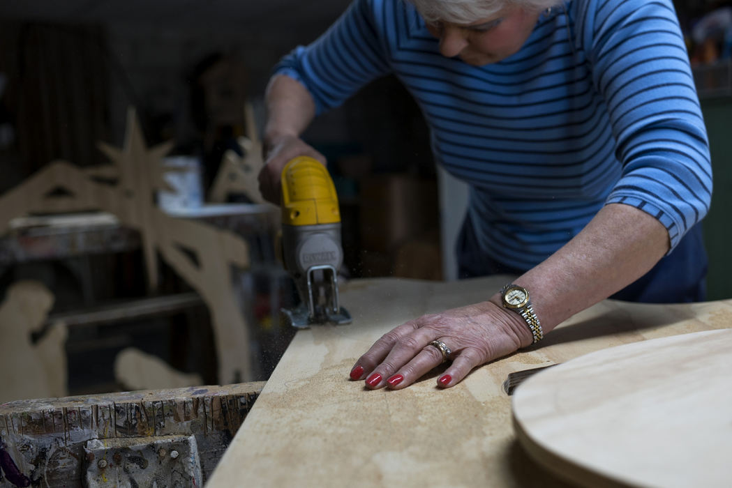 Third Place, Student Photographer of the Year - Marlena Sloss / Ohio UniversityMarge Stenftenagel works on her plywood yard art in her home on April 25, 2018. Marge feels she is still married to Si, and would never imagine taking off her wedding ring. Once, when doing laundry, her hand bumped the rim of the washing machine and the ring’s diamond fell inside. “That was scary,” she said. “It would have killed me. I would have died if it would have fallen down one of them holes. I’d probably cry like I cried when Si died.” 