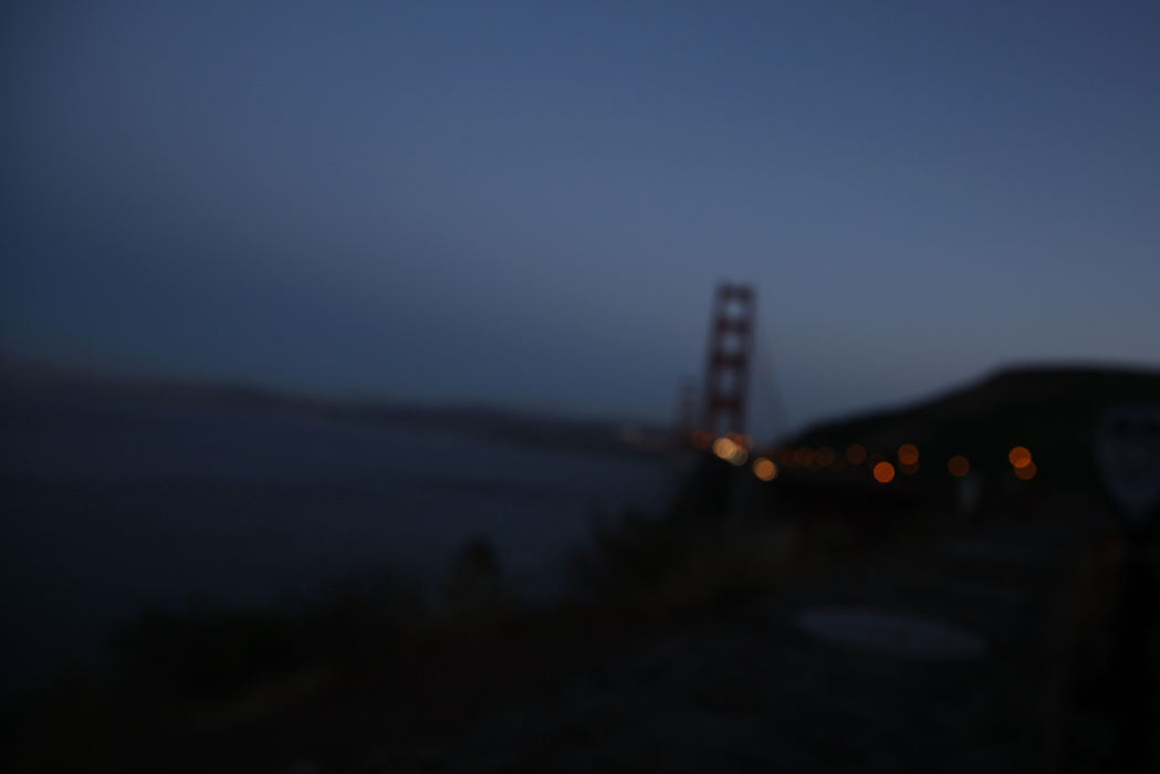 First Place, Feature Picture Story - Liz Moughon / Ohio University, "Finding Kyle"The Golden Gate Bridge is seen at dusk in San Francisco. While tourists stroll up and down it every day, on average someone jumps to their death every 13 days. Unlike other iconic structures, this bridge does not have a suicide barrier. After the Gamboa family lost their son to suicide, they resolved to do everything they could to campaign for a suicide barrier.