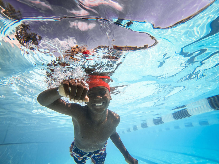 Third Place, Feature Picture Story - Meg Vogel / The Cincinnati Enquirer, "Rhinos"One weekday morning, D’Marco McCay didn't have his goggles for practice, so he squeezed his eyes tight when he went underwater. As he glided through the water, a grin spread across his face. 