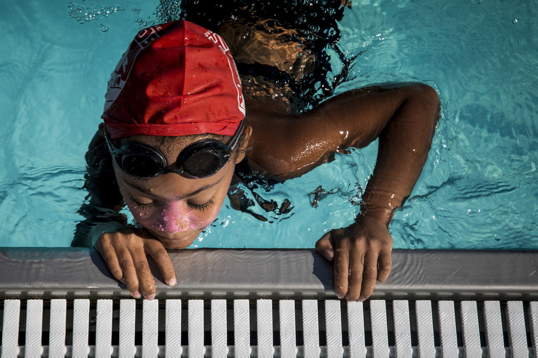 Third Place, Feature Picture Story - Meg Vogel / The Cincinnati Enquirer, "Rhinos"Aria Groomes reaches the wall during the final meet, July 28, 2018. 