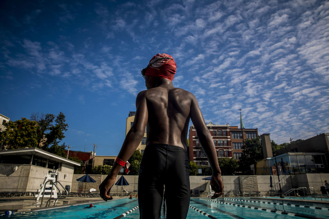 Third Place, Feature Picture Story - Meg Vogel / The Cincinnati Enquirer, "Rhinos"Jayden Davis stands on the edge of the pool for the final meet, July 28, 2018 at Ziegler Pool. 