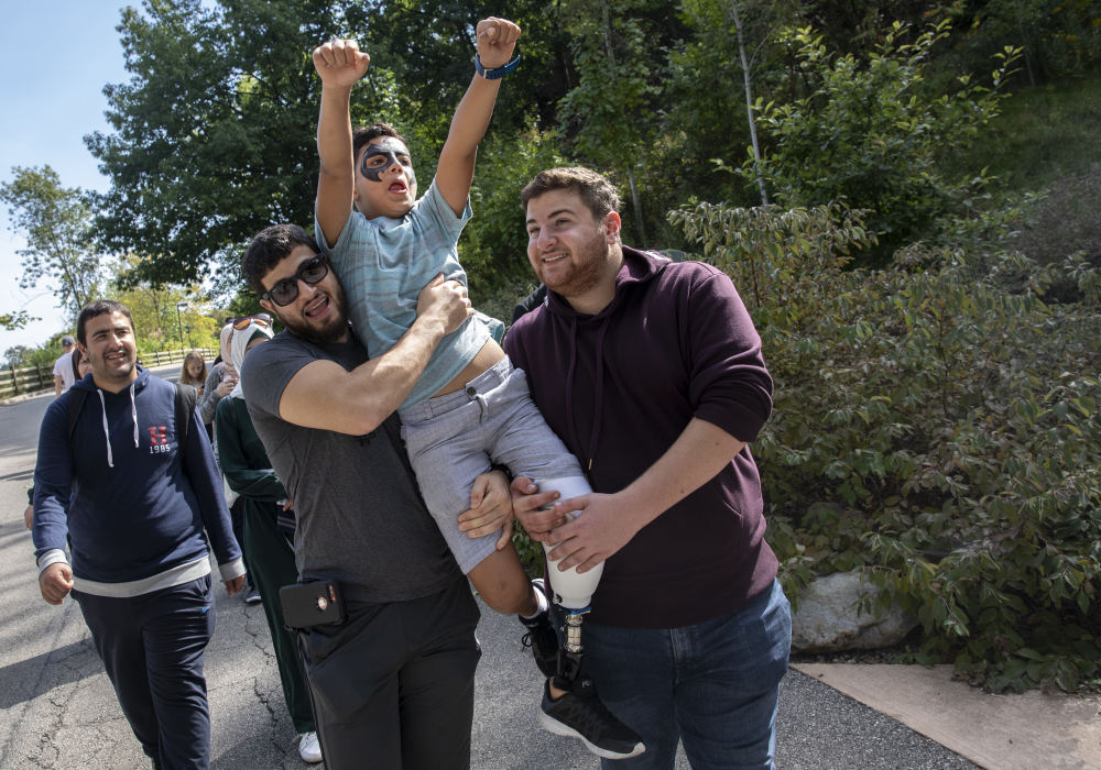 Award of Excellence, Feature Picture Story - Nathaniel Bailey / Kent State University, "Abood: Relief from Conflict"The Mujahed brothers pick up Abood, carrying him in response to his complaints about walking, as Abood pretends to celebrate a soccer goal.