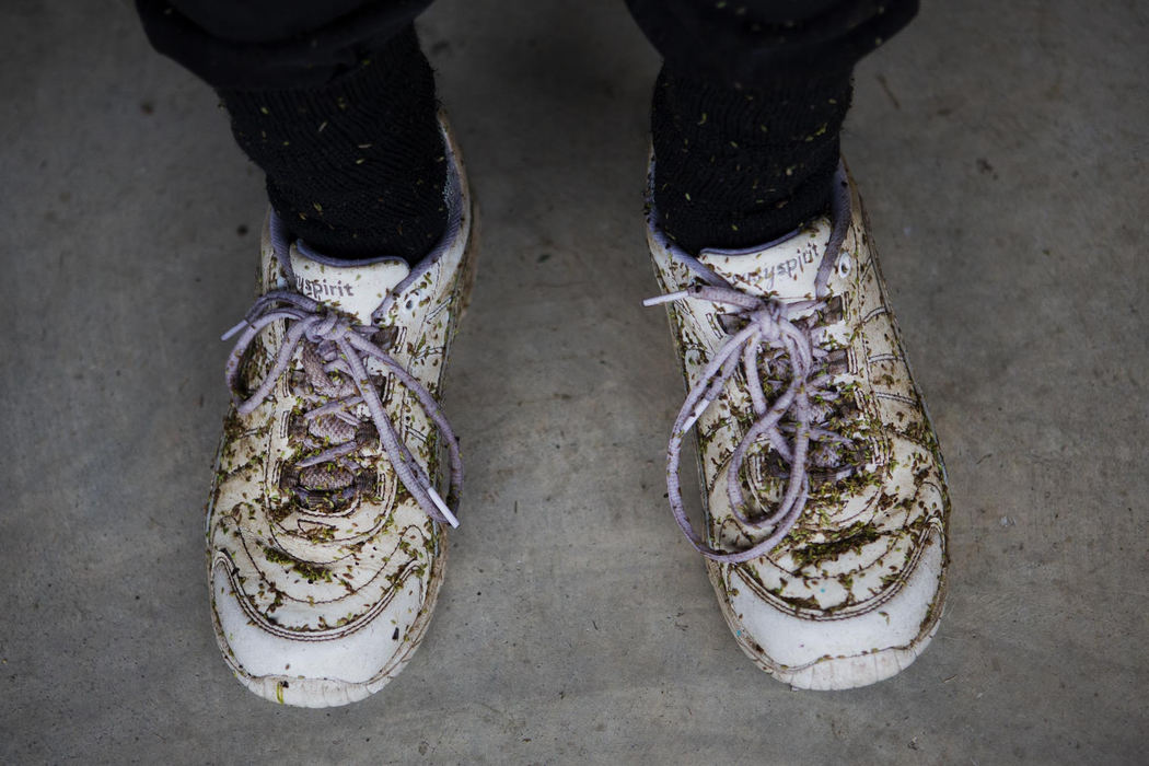 Second Place, Larry Fullerton Photojournalism Scholarship - Madeleine Hordinski / Ohio UniversityConnie's shoes are covered in seeds after gardening in her backyard on September 8, 2018, in Millfield.