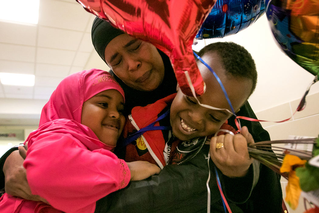 Award of Excellence, General News - Samantha Madar / Central Michigan University, "Reunited "Amina Ibrahim, 38, holds her children Mumtaz Billow, 5, (left) and Mohammed Bare, 6, at the John Glenn International Airport on September 28. Mohammed is likely to be the last refugee coming into Columbus this fiscal year.