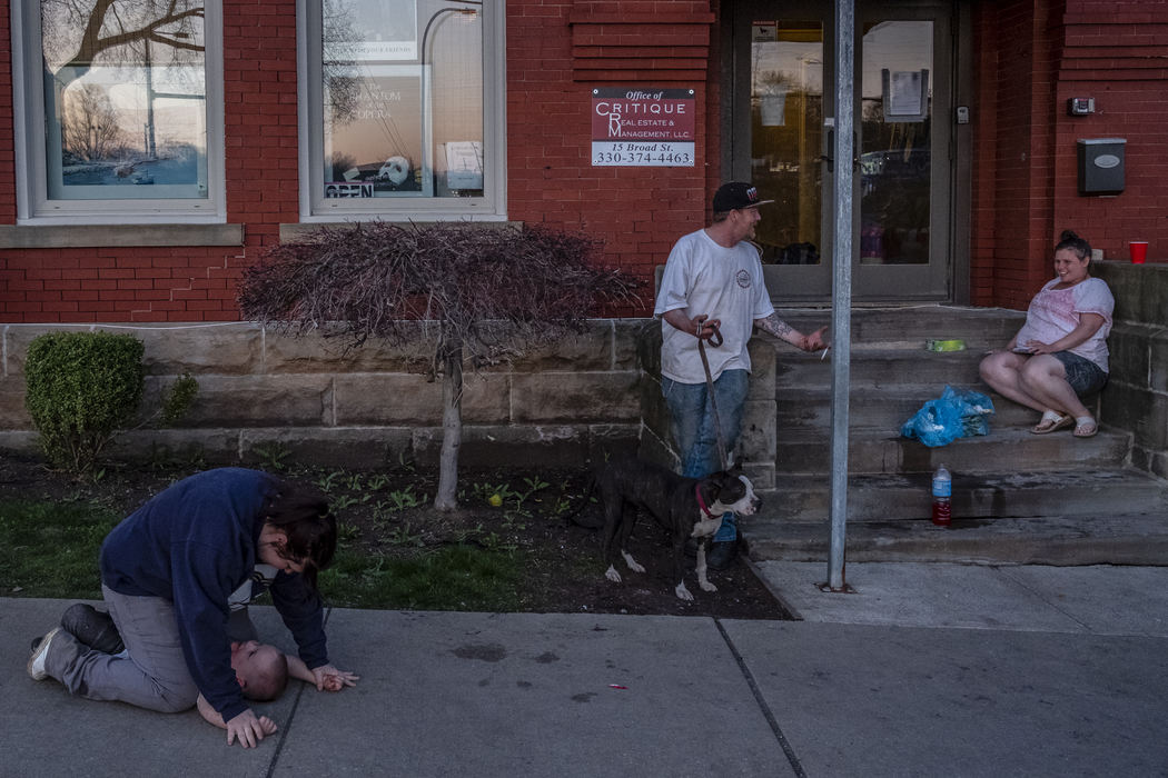 Second Place, News Picture Story - Nathaniel Bailey / Kent State University, "Tent City"People, all homeless, spend their evening outside the front entrance to 15 Broad St., home to tent city. Multiple complaints have been made by nearby residents about people loitering on the sidewalk.
