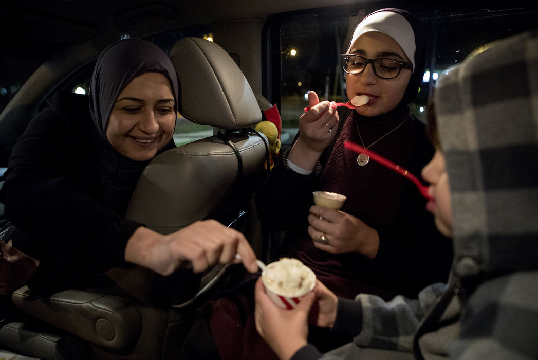 Second Place, Ohio Understanding Award - Jessica Phelps / Newark Advocate, "First Generation"Dunya steals a bite of her son, Mousa's frozen custard, October 16, 2018. The family stopped at the outdoor frozen custard shop on the way home from an awards ceremony. It was too cold to eat their treats outdoors, so they all piled into their car. 