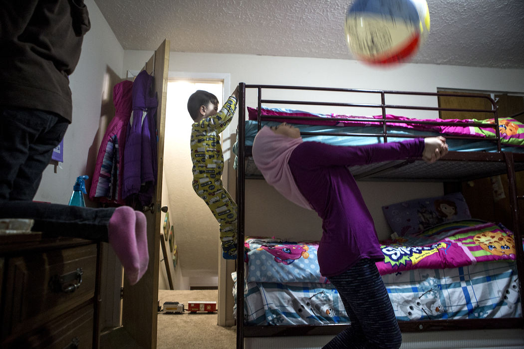 Second Place, Ohio Understanding Award - Jessica Phelps / Newark Advocate, "First Generation"Maryam, Mousa and Dima Al Haek all play in their bedroom before bedtime, January 16, 2018.
