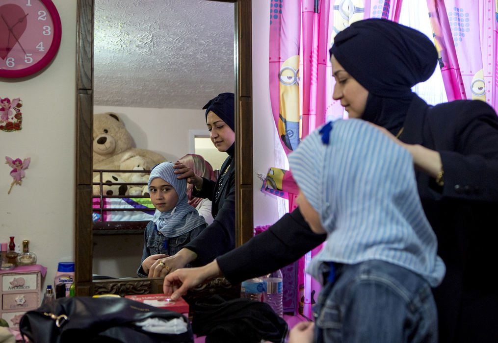 Second Place, Ohio Understanding Award - Jessica Phelps / Newark Advocate, "First Generation"Dunya Al Haek helps her daughter, Maryam, with her hijab before family and friends arrive for an engagement party for a family member March 25, 2018. Dunya and her husband Ahmed have been careful to keep Iraqi and Muslim traditions a strong part of their lives in Ohio with their three children. They also understand that their kids are growing up in America and will inevitably take on pieces American culture. Ahmed and Dunya believe that raising their children with the best of both worlds will give them many advantages in life. 