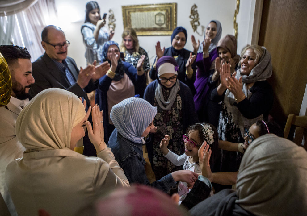 Second Place, Ohio Understanding Award - Jessica Phelps / Newark Advocate, "First Generation"Maryam Al Haek and her older sister Dima along and other with other family members dance traditional dances at an engagement party their family is holding for their aunt, Zainab March 25, 2018. The family is steadfastly holding onto their traditions and culture from Iraq while watching their children thrive in America. They believe blending the two worlds will give their children can more advantages in life. 