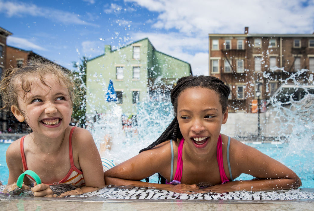 First Place, Photographer of the Year - Large Market - Meg Vogel / The Cincinnati EnquirerElsa McEwan and Layla Porter learn how to kick during the first swim practice of the Over-the-Rhine Rhinos, May 30, 2018. The team held practices five days a week. Most of the team members did not know how to swim on the first day.