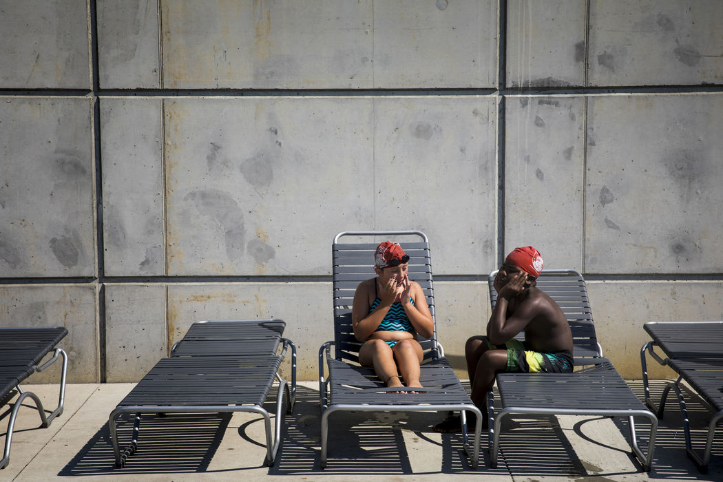 First Place, Photographer of the Year - Large Market - Meg Vogel / The Cincinnati EnquirerMyla McKinney and Ben Yisrael take a break during a Rhinos practice.