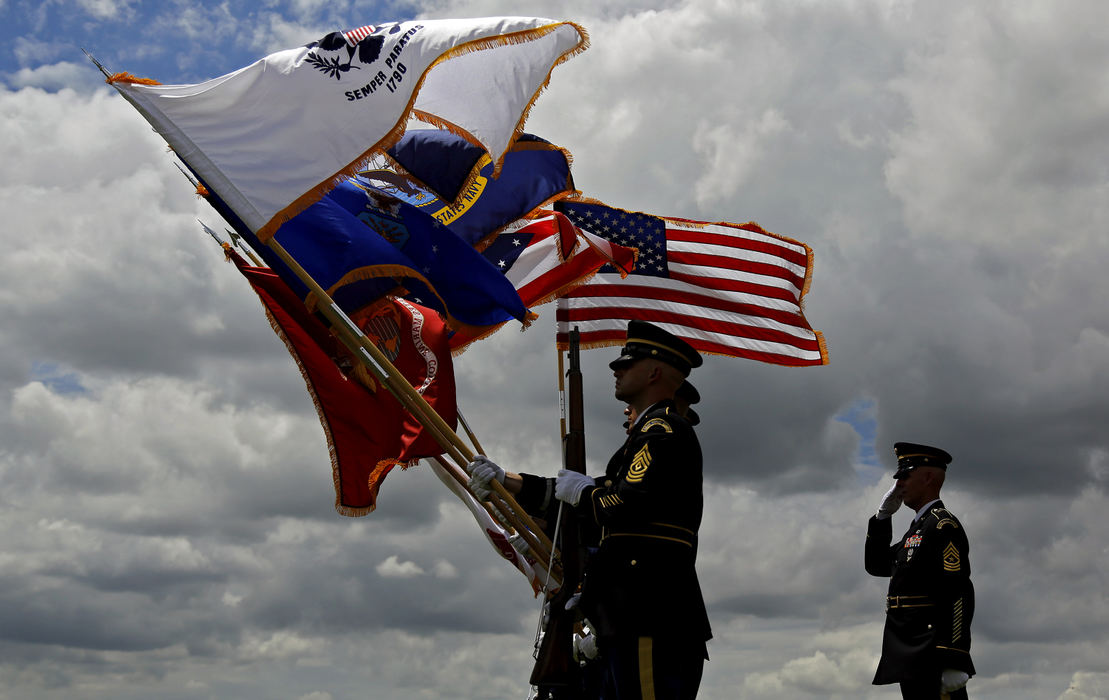 Second Place, Photographer of the Year - Large Market - Kyle Robertson / The Columbus DispatchSgt. Maj. Shawn Hayslett (right) salutes the flags while the Ohio National Guard Color Guard holds the flag during the playing of the National Anthem before the Memorial Honoree Ceremony at Muirfield Village Golf Club in Dublin, Ohio on May 30, 2018.  