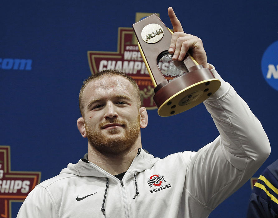 Second Place, Photographer of the Year - Large Market - Kyle Robertson / The Columbus DispatchOhio State’s Kyle Snyder (285) celebrates after beating Michigan’s Adam Conn to win the 285 finals during the 2018 NCAA Division I wrestling championships at Quicken Loans Arena in Cleveland on March 17, 2018. 