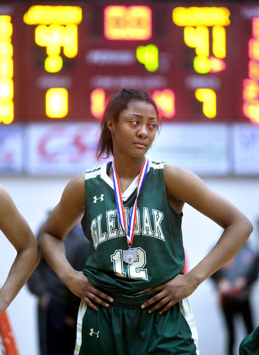 Award of Excellence, Photographer of the Year - Small Market - Scott Heckel / The Canton RepositoryTears stream down the face of GlenOak's Aniyah Hall after losing 44-41 to Jackson in D1 district final at the Canton Memorial Field House on Thursday, March 1, 2018. 