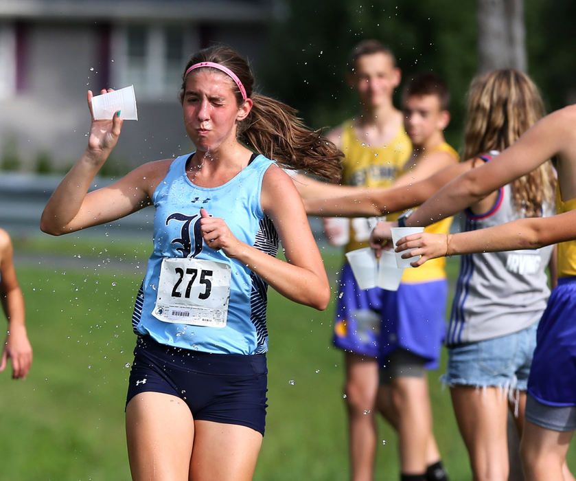 Award of Excellence, Photographer of the Year - Small Market - Scott Heckel / The Canton RepositoryLouisville's Emma Patterson took a drink of water before pouring the rest on her face duing the East Canton Invitational Cross Country Meet in East Canton on Thursday, August 30, 2018. Patterson finished third. 