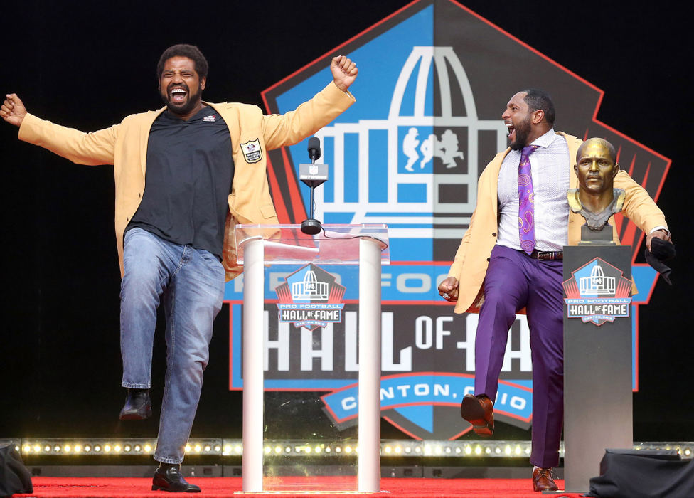 Award of Excellence, Photographer of the Year - Small Market - Scott Heckel / The Canton RepositoryRay Lewis (right), and and his former Ravens teammate Jonathan Ogden, recreate Lewis' pregame dance during Lewis' speech at the Pro Football Hall of Fame Festival Enshrinement in Canton on Saturday, August 4, 2018. Ogden was enshrined in 2013.