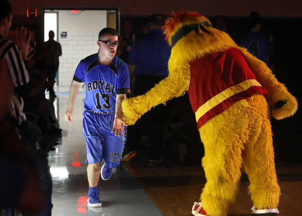 Award of Excellence, Photographer of the Year - Small Market - Scott Heckel / The Canton RepositoryRoyal Knights' Cameron Broom greets Canton Charge mascot "Pozzie" while being introduced before their Stark Public Special Olympics game against Medina DD at Louisville on Thursday, Jan. 11, 2018.