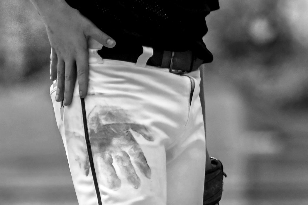 First Place, Photographer of the Year - Small Market - Jessica Phelps / Newark AdvocateDan's Family Pizza pitcher, Chase Wolfe, leaves a handprint on his pants after testing the dirt with hands. Wolfe was pitching tough game during the elite eight week June 16 during the Shrine Tournament, which they won advancing them to the quarterfinal round. 