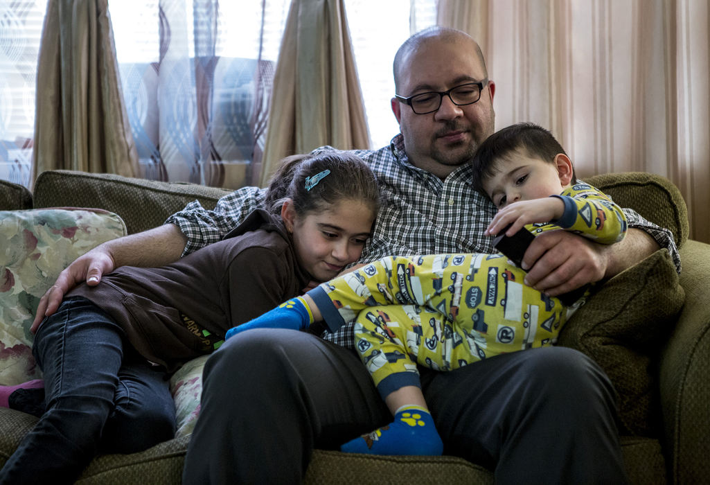 First Place, Photographer of the Year - Small Market - Jessica Phelps / Newark AdvocateAhmed Al Haek curls up on the couch with his two youngest children, Maryam, 8, and Mousa, 3. Ahmed has always been very affectionate with his children. He moved his family to America in 2011 because Iraq was no longer safe for his family after he worked as a translator with the US military.Ahmed loves the opportunities America can give his children but is careful to hold tight to Iraqi traditions. 