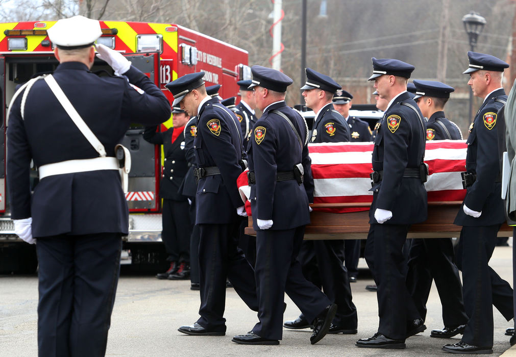 Second Place, Photographer of the Year - Small Market - Lorrie Cecil / ThisWeek NewspapersWesterville Police Officers carry the body of Officer Eric Joering out of St. Paul the Apostle Parish.  A joint service for Joering and  Officer Anthony Morelli were held on Friday February 16.   